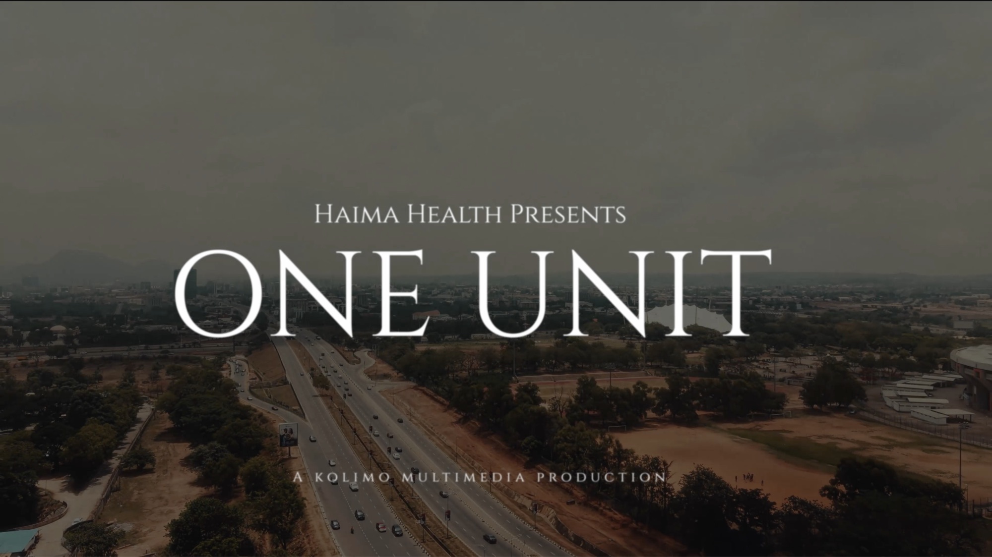 Aerial city view with the One Unit title across the frame, presented by Haima Health